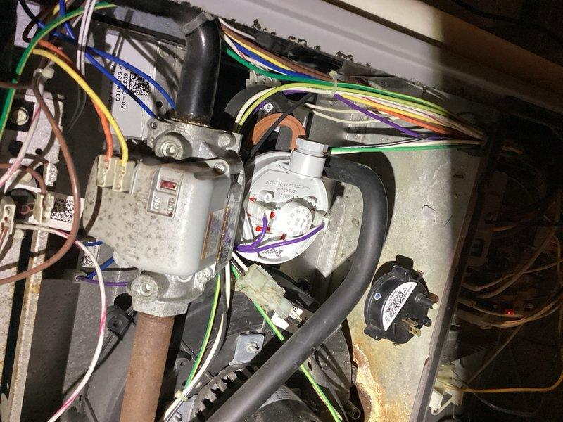 # HVAC Service - No Heat 10+ Years Old

Responded to no heat call for furnace system over 10 years old. Upon arrival, diagnosed furnace failure to ignite due to a failed pressure switch and leaking collector box. Performed diagnostic testing using digital multimeter to verify pressure switch malfunction and confirm improper venting conditions. Replaced defective pressure switch to restore immediate heating function. Identified collector box leak requiring replacement and ordered new collector box assembly for follow-up installation. System restored to operational status with temporary repair pending collector box replacement.