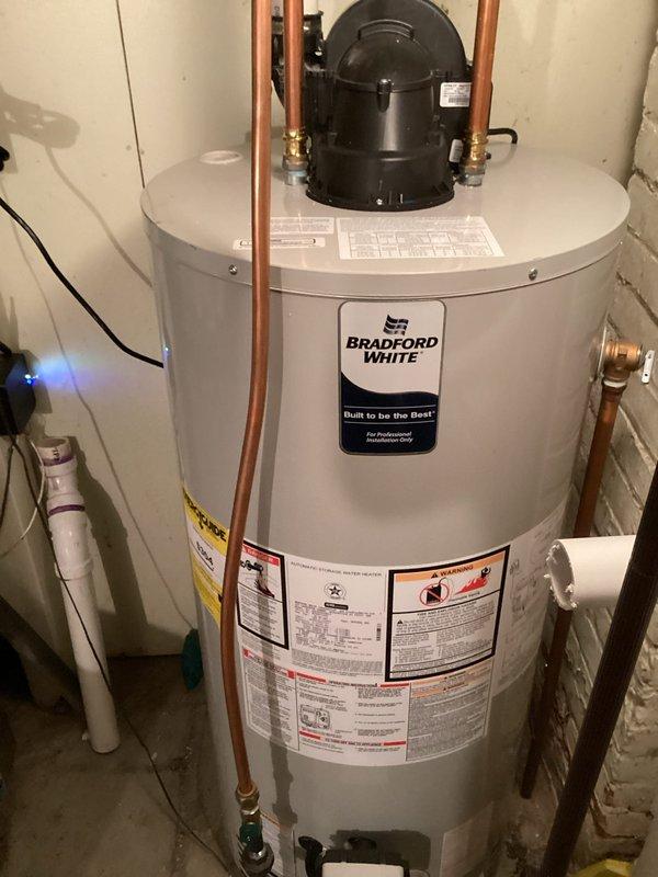 Completed no-charge callback to upgrade venting material on recently installed Bradford White power vent water heater. Removed non-compliant soft core venting and replaced with code-compliant solid core Schedule 40 PVC piping to ensure proper and safe exhaust ventilation for the power vent system.