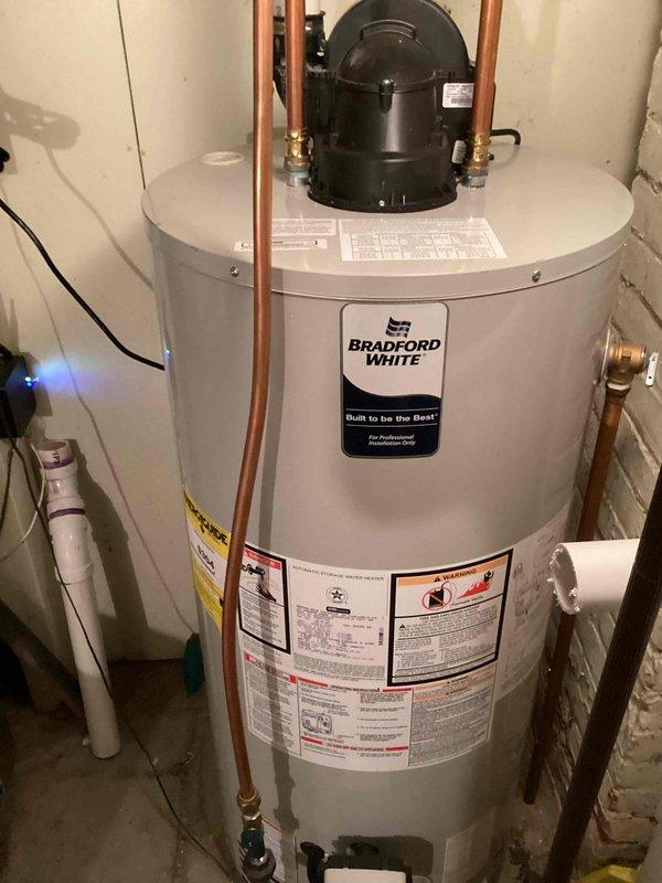 Completed no-charge callback to upgrade venting material on recently installed Bradford White power vent water heater. Removed non-compliant soft core venting and replaced with code-compliant solid core Schedule 40 PVC piping to ensure proper and safe exhaust ventilation for the power vent system.