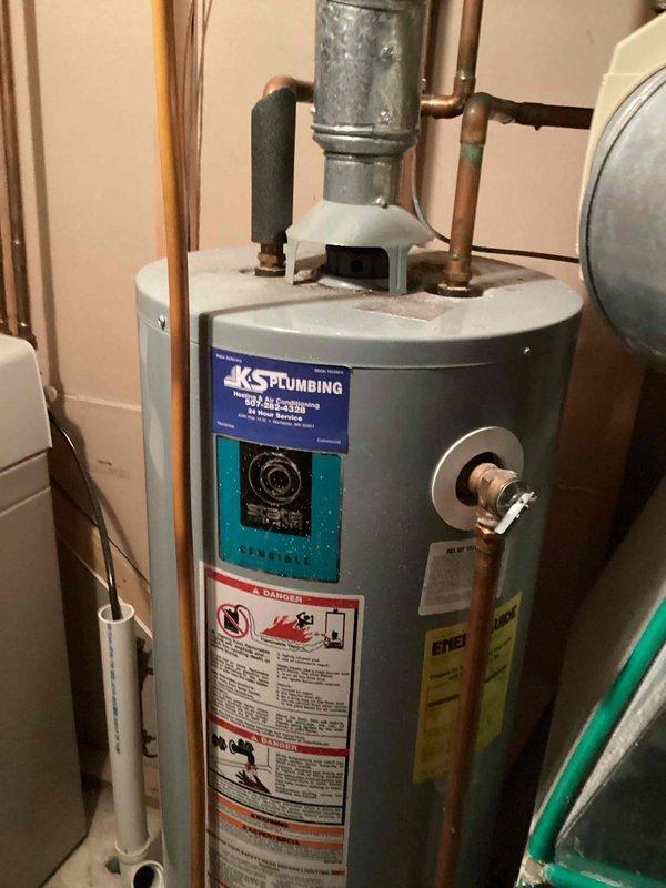 Arrived on-site within scheduled 8-12 arrival window and performed comprehensive assessment of existing 40-gallon natural gas water heater with standard atmospheric venting. Evaluated current installation including all copper supply line connections, gas line configuration, temperature and pressure relief valve operation, and venting system integrity. Provided detailed estimate for complete water heater replacement with new 40-gallon natural gas standard vent unit, including removal and disposal of existing equipment, installation of new unit to current code specifications, and connection of all necessary plumbing and gas lines.