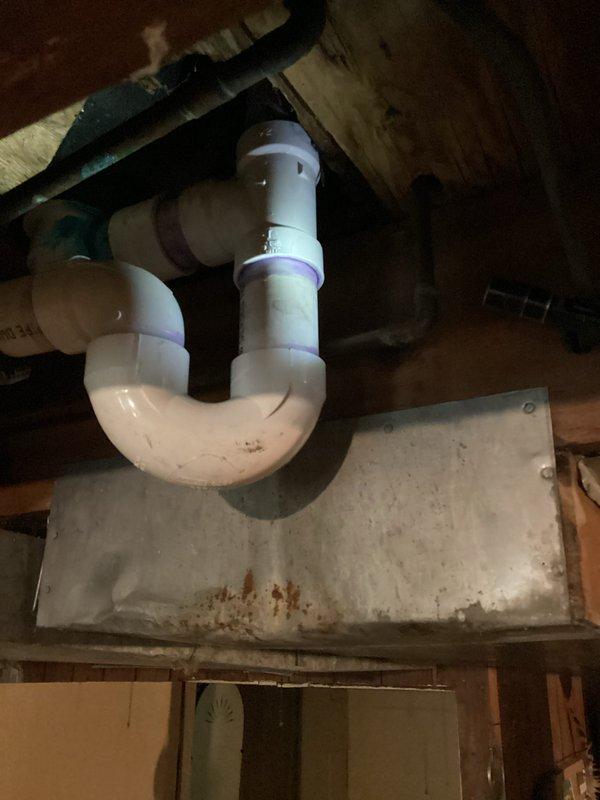 Responded to drain leak in shower system. Upon arrival, found broken 1.5-inch PVC drain line beneath shower requiring immediate repair. Replaced damaged section of drain pipe and installed new elbow fitting to restore proper drainage function. Secured all connections with appropriate PVC fittings and ensured P-trap configuration remained intact for proper water seal. Tested system for leaks and verified complete repair of drainage assembly.