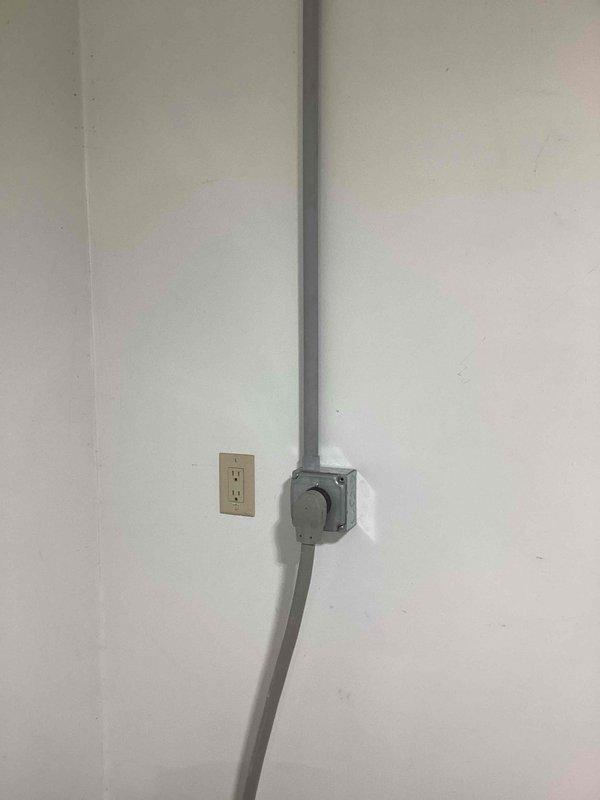 Returned to site to upgrade electrical wiring for kiln circuit. Removed existing 8 AWG wire and installed 6 AWG wire from basement junction box to kiln outlet, running through existing conduit system. Surface-mounted conduit and junction box configuration verified and secured to wall, ensuring proper electrical capacity for kiln operation.