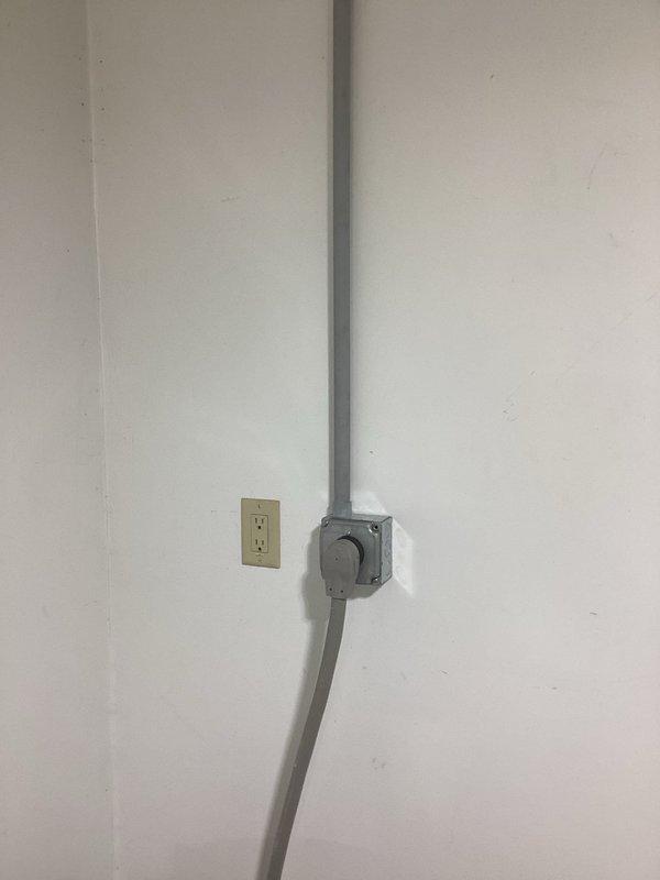 Returned to site to upgrade electrical wiring for kiln circuit. Removed existing 8 AWG wire and installed 6 AWG wire from basement junction box to kiln outlet, running through existing conduit system. Surface-mounted conduit and junction box configuration verified and secured to wall, ensuring proper electrical capacity for kiln operation.