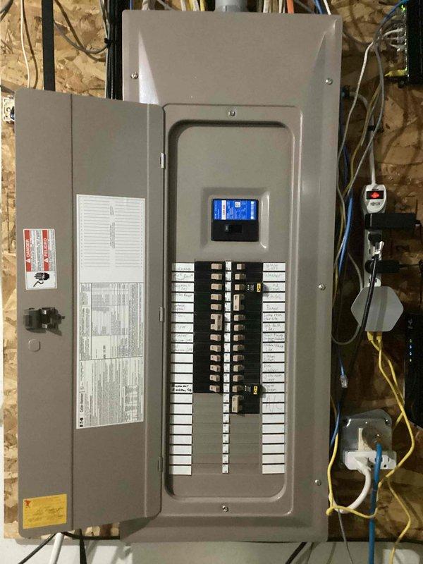 Rewired utility room outlet to provide continuous power for water softener operation. The outlet was previously controlled by the utility room light switch, which interrupted power when the light was turned off. Modified circuit at the electrical panel to bypass the switch control, ensuring the outlet remains energized at all times while maintaining the independent operation of the utility room lighting circuit.
