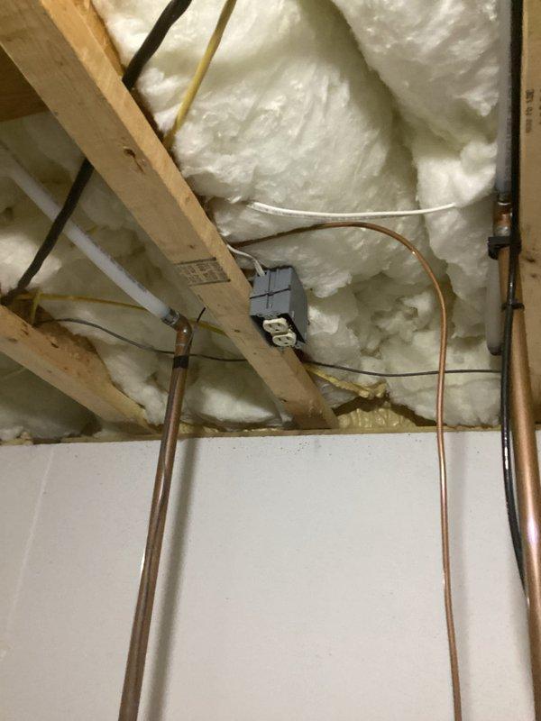 Rewired utility room outlet to provide continuous power for water softener operation. The outlet was previously controlled by the utility room light switch, which interrupted power when the light was turned off. Modified circuit at the electrical panel to bypass the switch control, ensuring the outlet remains energized at all times while maintaining the independent operation of the utility room lighting circuit.