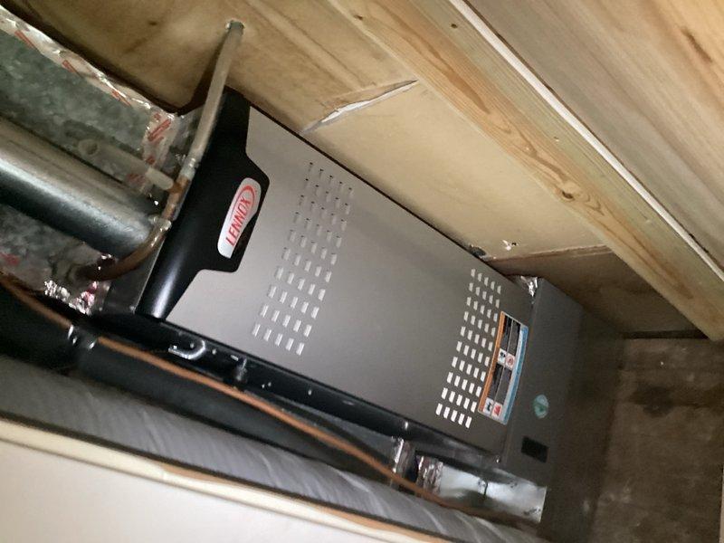 Responded to no cooling call on 10+ year old system. Found condenser fan motor catching and failing to operate properly. Removed fan shroud to access and assess condenser fan motor assembly for replacement recommendation.