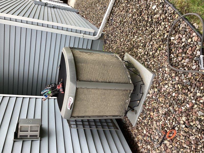 Completed preventive maintenance tune-up on residential air conditioning system. Unit was operating within normal parameters with no deficiencies noted. Cleaned condenser coil on outdoor unit and installed new air filter to ensure optimal airflow and system efficiency.