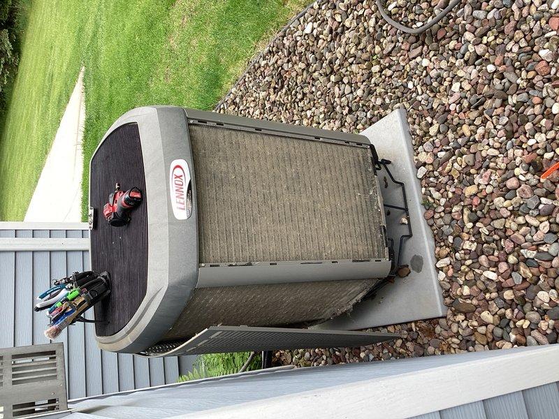 Completed preventive maintenance tune-up on residential air conditioning system. Unit was operating within normal parameters with no deficiencies noted. Cleaned condenser coil on outdoor unit and installed new air filter to ensure optimal airflow and system efficiency.