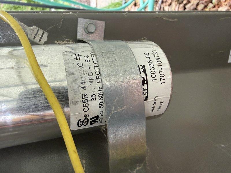 Performed preventive maintenance tune-up on residential air conditioning system. Upon inspection, identified failed capacitor preventing proper compressor operation. Replaced defective capacitor with new unit rated at 35/5 MFD, 370V, restoring system to full operational capacity.