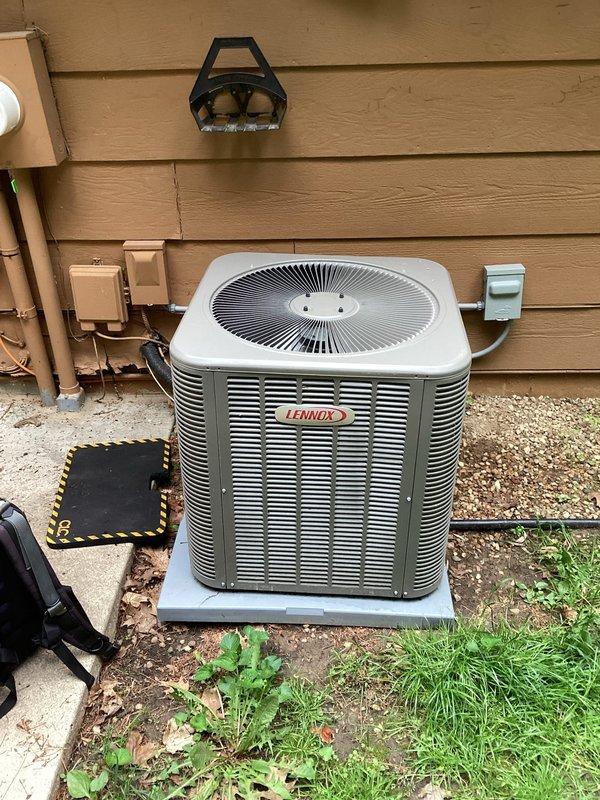 Responded to no cooling complaint on residential Lennox air conditioning system. Diagnosed failed Mastertrol Mark V automatic balancing zoning system control panel preventing proper system operation. Bypassed failed zoning controls and landed condenser wire directly at furnace to restore cooling functionality.