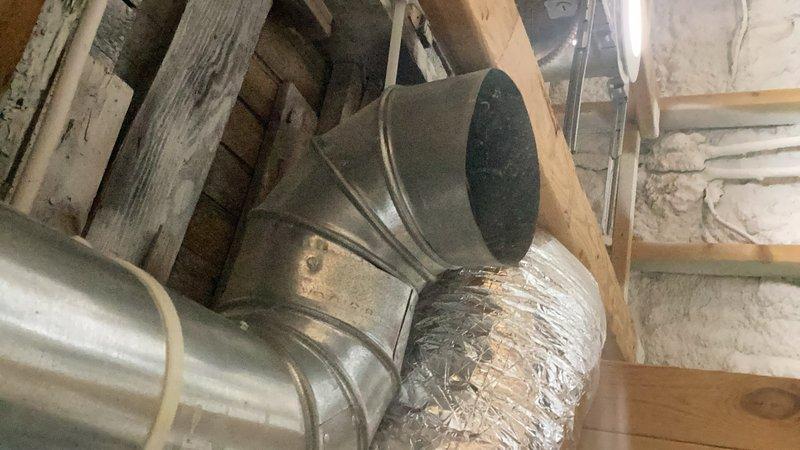 Responded to service call for non-operational humidifier and general HVAC inspection. Upon arrival, discovered zone system had been unplugged and identified significant ductwork modifications where the house had been converted from a multi-zone to single-zone system. Inspected metal ductwork in attic space, including galvanized sheet metal sections with elbow joints and flexible aluminum ducting connections. Documented existing duct configuration and conversion work for further evaluation. Referred case to estimating department for proper system assessment and recommendations to address the zone conversion and associated ductwork concerns.