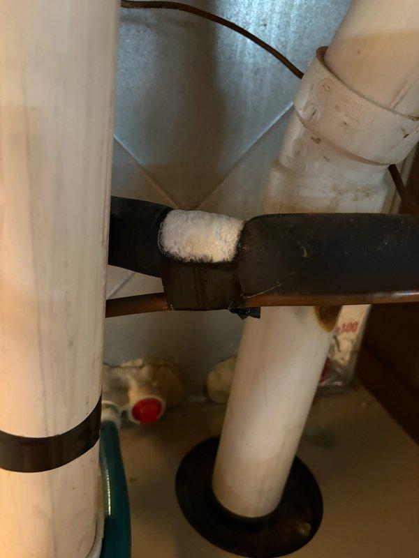 Responded to no cooling complaint on York air conditioning system. Upon arrival, found extensive frost buildup on refrigerant lines in basement area, indicating system malfunction. Performed diagnostic evaluation and identified active refrigerant leak in the system. Due to the age of the unit and the extent of repairs required, recommended complete system replacement as the most cost-effective solution. Documented conditions with photographs showing frosted suction line and outdoor condensing unit.