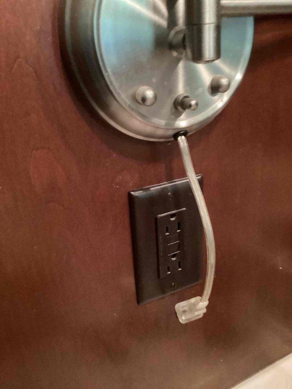 Completed home inspection electrical corrections including installation of GFCI outlets in utility room, outdoor locations with weatherproof covers, and upstairs bathroom. Bonded CSST gas line to water heater per code requirements. Installed dedicated breaker for dishwasher circuit. Verified existing GFCI protection in garage met code standards and confirmed basement bathroom outlet installation was declined by homeowner.