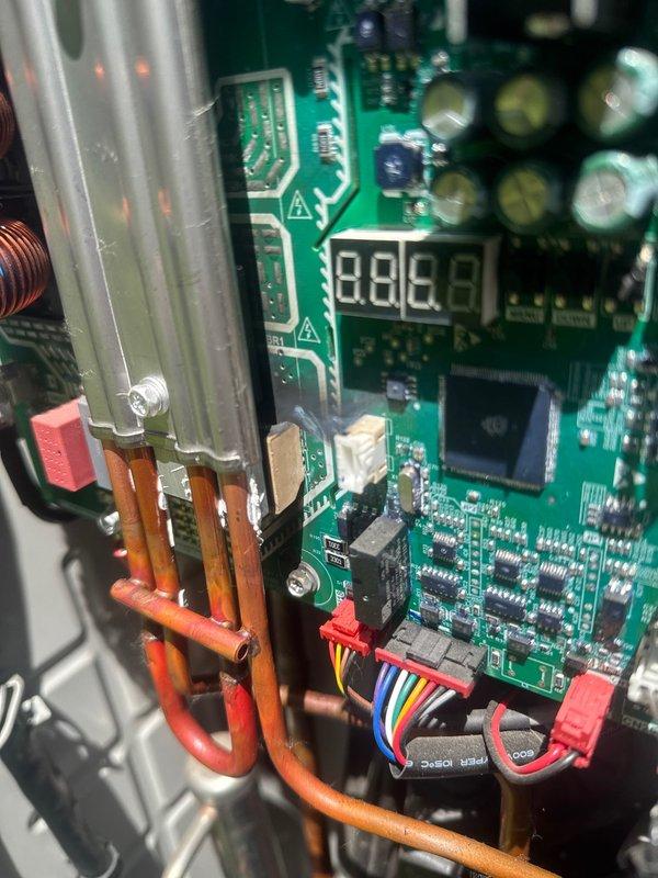 Responded to no cooling complaint on Lennox heat pump system. Upon inspection, discovered burned inverter control board assembly, which was preventing the unit from operating in cooling mode. Documented damaged PCB components and provided estimate for replacement board installation.
