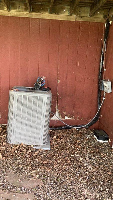 Responded to no cooling complaint on aging outdoor AC unit. Upon arrival, found compressor seized and inoperable. Unit showed significant debris accumulation around condenser coils and evidence of extended outdoor exposure. Attempted compressor restart using hard start kit without success. Coordinated with project management team to discuss full system replacement options given unit age and compressor failure.