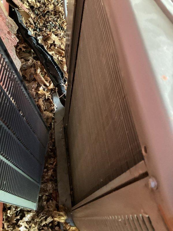 Responded to no cooling complaint on aging outdoor AC unit. Upon arrival, found compressor seized and inoperable. Unit showed significant debris accumulation around condenser coils and evidence of extended outdoor exposure. Attempted compressor restart using hard start kit without success. Coordinated with project management team to discuss full system replacement options given unit age and compressor failure.