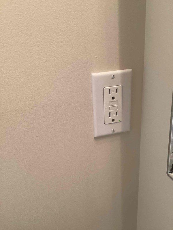 Completed comprehensive electrical inspection of residential property. Identified code compliance issue requiring GFCI protection at washing machine location. Provided estimate for GFCI outlet installation and documented existing conditions with photographs of electrical components and work area.