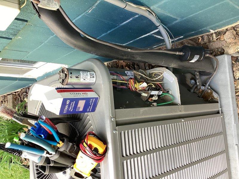 Completed one-time AC tune-up on outdoor condensing unit. During system inspection, identified failed capacitor with low microfarad reading. Replaced defective capacitor with new unit to restore proper compressor and fan motor operation, ensuring optimal system performance.