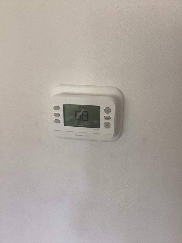 Responded to service call for programmable thermostat installation assistance. Upon arrival, determined existing thermostat wire at furnace was insufficient for proper connection of new Honeywell digital programmable thermostat. Ran new thermostat wire from furnace to wall location and completed installation, ensuring proper communication between thermostat and heating system.