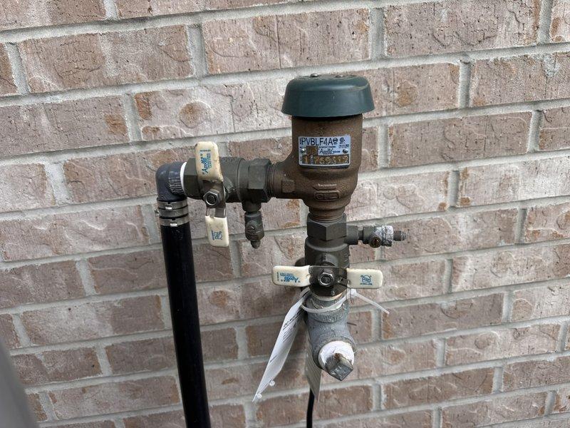 Responded to callback for repair of outdoor irrigation line that was accidentally punctured near the water shutoff valve. Successfully repaired the damaged pipe section and restored system integrity. All plumbing components, including backflow prevention assembly and pressure regulation system mounted on exterior wall, were inspected and confirmed to be functioning properly upon completion.