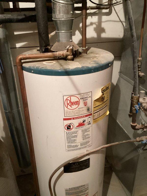 Responded to service call for rust-colored water throughout entire residence supplied by well water system. Conducted on-site inspection of existing water treatment equipment and plumbing infrastructure, documenting current configuration including water softener unit, pressure tank, and filtration system. Assessed water quality issues and determined high iron content in well water with no existing iron filtration system installed. Photographed mechanical room setup showing current plumbing arrangement, copper piping, existing blue filter cartridge, water heater, and treatment equipment. Prepared and provided detailed estimate for installation of new iron filter system to address elevated iron levels and eliminate rust discoloration in household water supply.