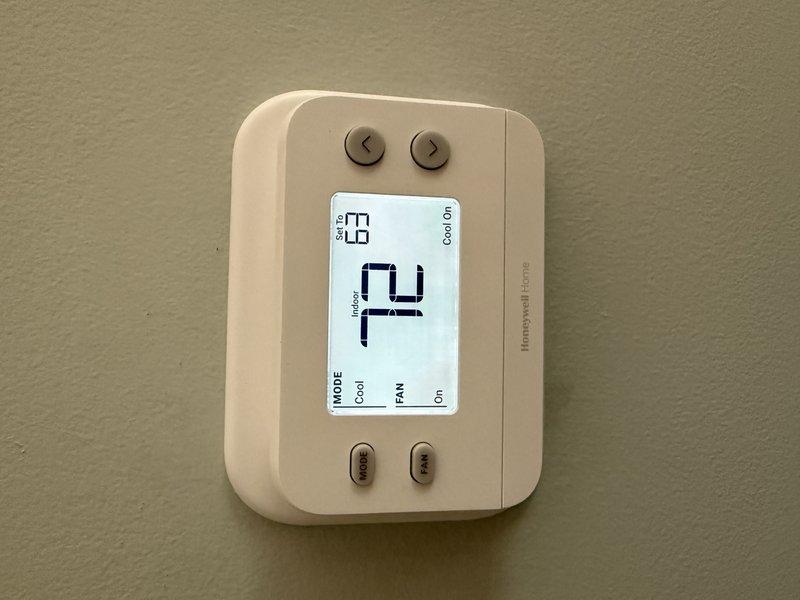 Responded to no cooling complaint on aging air conditioning system. Diagnosed faulty thermostat as cause of system failure and successfully replaced unit with new Honeywell Home digital programmable thermostat, restoring proper cooling operation to the residence.