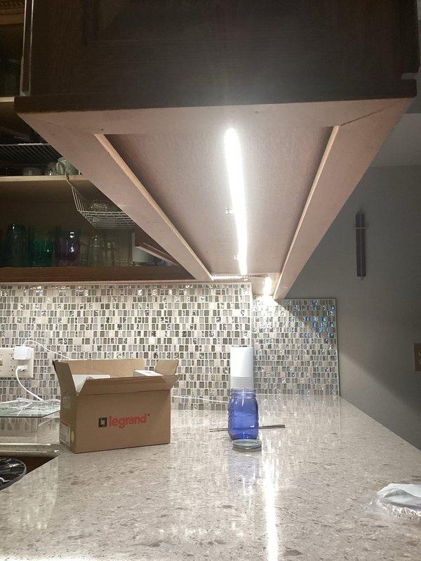 Installed LED strip lighting under kitchen cabinets to provide task illumination over granite countertops with mosaic tile backsplash. Added new switches and GFCI-protected outlets near the patio area to meet code requirements and provide safe outdoor electrical access. All electrical work was completed per estimate specifications and tested for proper operation.