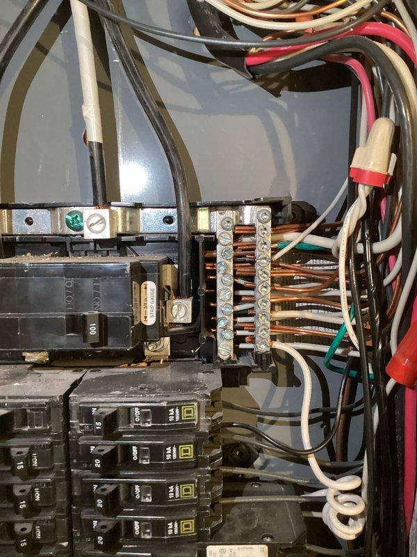 Responded to service call following home inspection findings of double-tapped neutral conductors in main electrical panel. Corrected code violations by removing grounds from neutral bus bar to free terminal spaces, then properly separated all double-tapped neutral wires to individual connection points per current NEC requirements. All conductors were properly secured and torqued to manufacturer specifications, restoring panel to compliant configuration.