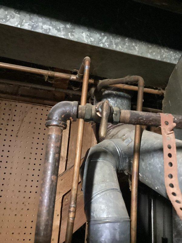 Completed comprehensive plumbing inspection for residential property sale. Thoroughly evaluated all visible plumbing systems including bathroom fixtures, bathtub and shower assembly with wall-mounted controls, and accessible piping infrastructure in attic space. Inspected copper supply lines, flexible ductwork connections, mounting brackets, and mechanical system components for proper installation and condition, documenting findings with photographs for sale disclosure purposes.