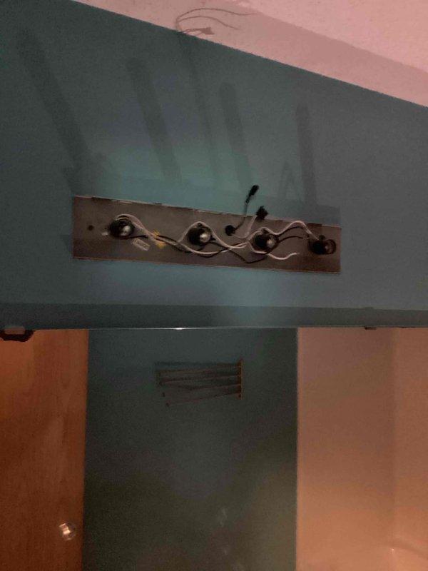 Responded to same-day service request for bathroom vanity light replacement. Removed existing light fixture and installed customer-supplied decorative vanity light fixture on teal-painted bathroom wall. Ensured proper electrical connections, secure mounting, and verified functionality of new fixture upon completion.