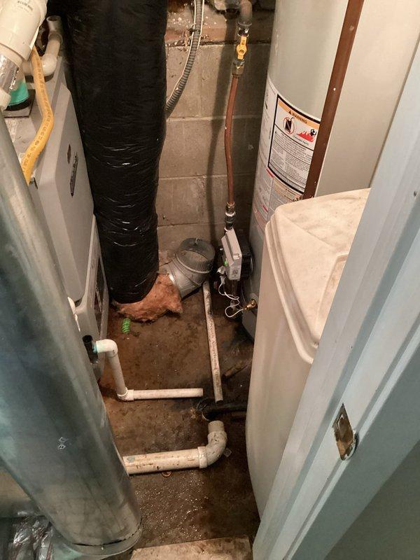 Completed full replacement of 40-gallon natural gas water heater in basement utility area. Removed existing unit and installed new white residential water heater with proper copper piping connections, brass fittings, and valves. Ensured all plumbing connections were secure and compliant with code requirements, including proper venting and gas line connections. Homeowner was not present during service; accessed property as arranged and coordinated completion confirmation upon finishing the installation.