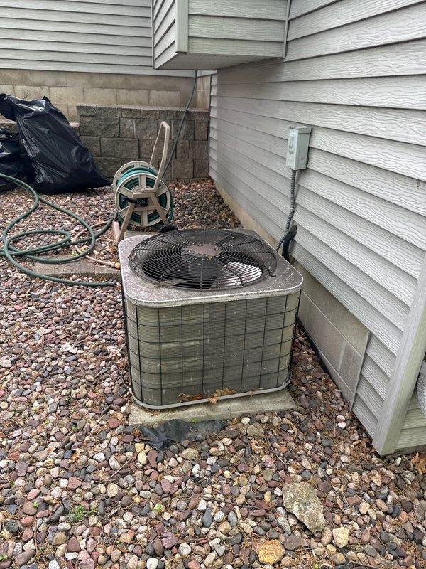 Completed one-time air conditioning tune-up on outdoor condensing unit. Performed standard preventive maintenance procedures including inspection of electrical components, condenser coil cleaning, and system operational checks. Unit found in normal working condition with typical outdoor weathering and surface debris accumulation.