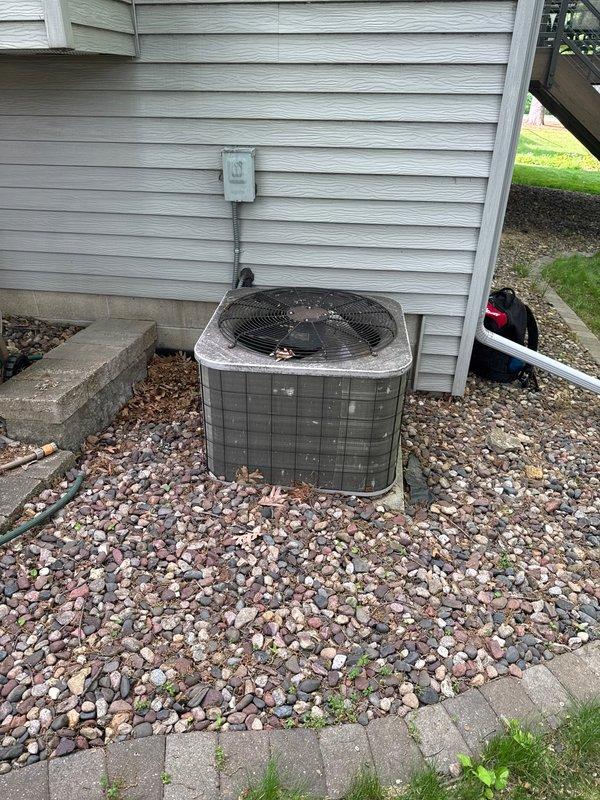 Completed one-time air conditioning tune-up on outdoor condensing unit. Performed standard preventive maintenance procedures including inspection of electrical components, condenser coil cleaning, and system operational checks. Unit found in normal working condition with typical outdoor weathering and surface debris accumulation.