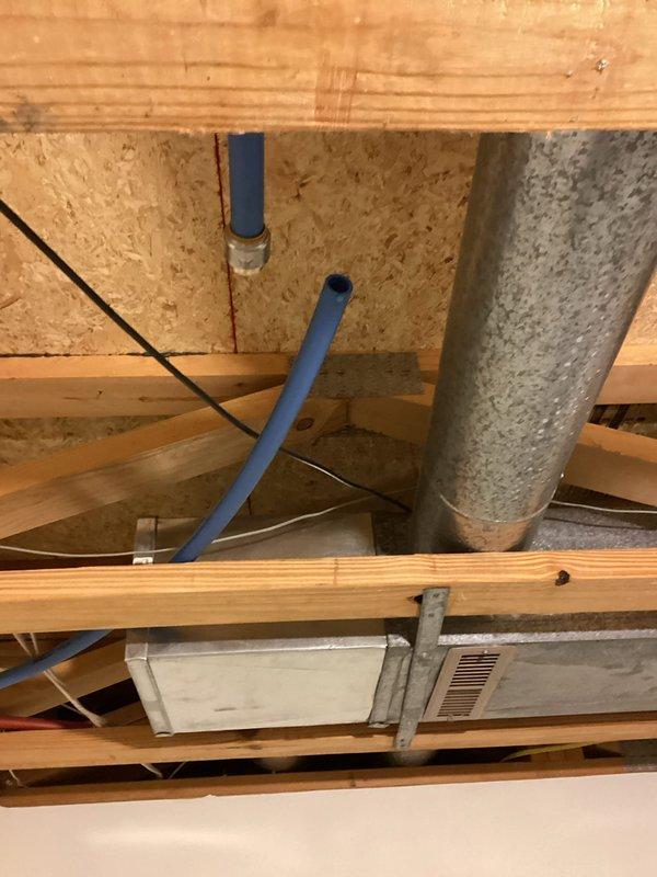 Responded to emergency call for leaking outdoor water line. Upon arrival, found burst pipe connected to exterior spigot and irrigation system located under deck. Pipe had frozen and ruptured due to exposure to winter elements. Accessed plumbing through interior crawl space where copper supply lines were routed. Cut damaged section of water line and installed permanent cap to prevent future freeze damage. Verified all connections were secure and leak-free before restoring system.