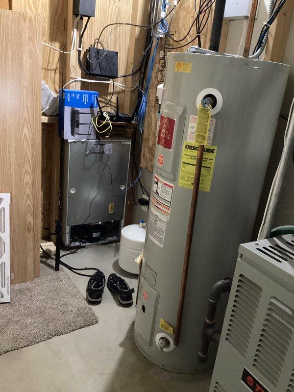 Conducted on-site assessment of existing 52-gallon State Industries electric water heater (Model CE6-52-2DRTV) located in unfinished utility area. Documented current equipment specifications, electrical connections, and installation configuration. Provided comprehensive estimate for replacement with new 50-gallon electric water heater unit.