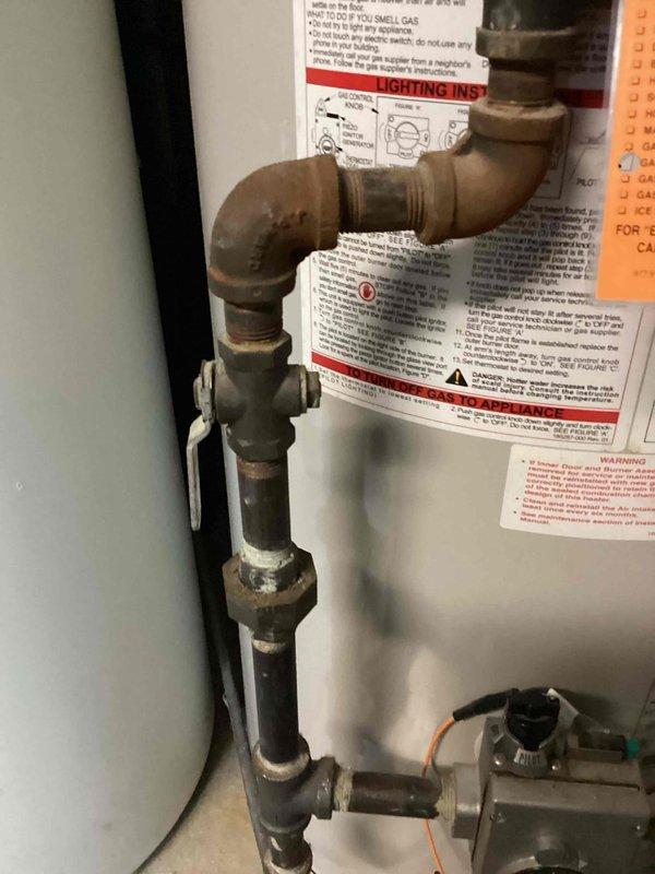 Responded to emergency gas leak in mechanical room where utility company had shut off gas supply to residence. Upon arrival, identified active gas leak at water heater shut-off valve through leak detection procedures. Shut off main gas supply to home for safety. Removed defective shut-off valve from gas line serving A.O. Smith ProMax water heater. Installed new gas shut-off valve using proper threading and sealing techniques per code requirements. Restored gas service to residence and performed comprehensive gas leak detection throughout all connections and fittings in mechanical room. Confirmed complete elimination of gas leak with no further detection at water heater shut-off valve or surrounding gas piping. System returned to safe operational status.