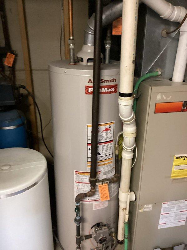 Responded to emergency gas leak in mechanical room where utility company had shut off gas supply to residence. Upon arrival, identified active gas leak at water heater shut-off valve through leak detection procedures. Shut off main gas supply to home for safety. Removed defective shut-off valve from gas line serving A.O. Smith ProMax water heater. Installed new gas shut-off valve using proper threading and sealing techniques per code requirements. Restored gas service to residence and performed comprehensive gas leak detection throughout all connections and fittings in mechanical room. Confirmed complete elimination of gas leak with no further detection at water heater shut-off valve or surrounding gas piping. System returned to safe operational status.
