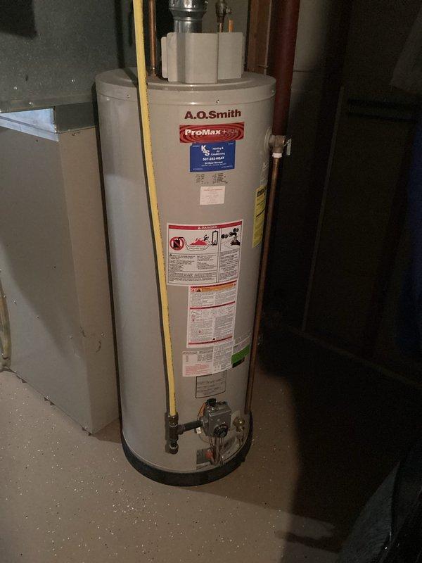 Responded to service call for A.O. Smith ProMax Plus tanked water heater with no ignition. Upon arrival, diagnosed failed igniter with no spark generation at burner assembly. Replaced igniter component and tested gas control valve operation to restore proper heating function.