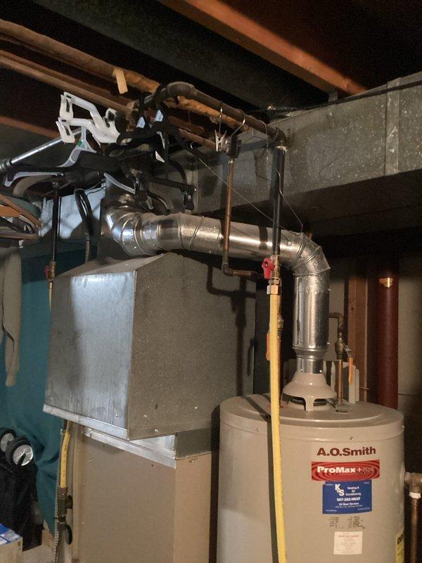 Responded to service call for A.O. Smith ProMax Plus tanked water heater with no ignition. Upon arrival, diagnosed failed igniter with no spark generation at burner assembly. Replaced igniter component and tested gas control valve operation to restore proper heating function.