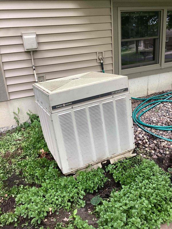 Responded to no cooling call on General Electric air conditioning system. Upon arrival, confirmed thermostat was calling for cooling but outdoor condensing unit was not operating. Performed diagnostic evaluation and determined system was critically low on refrigerant charge. Given the age of the unit (10+ years old), extent of refrigerant loss, and overall condition of the equipment, recommended full system replacement rather than repair. Customer approved replacement of aging AC unit.
