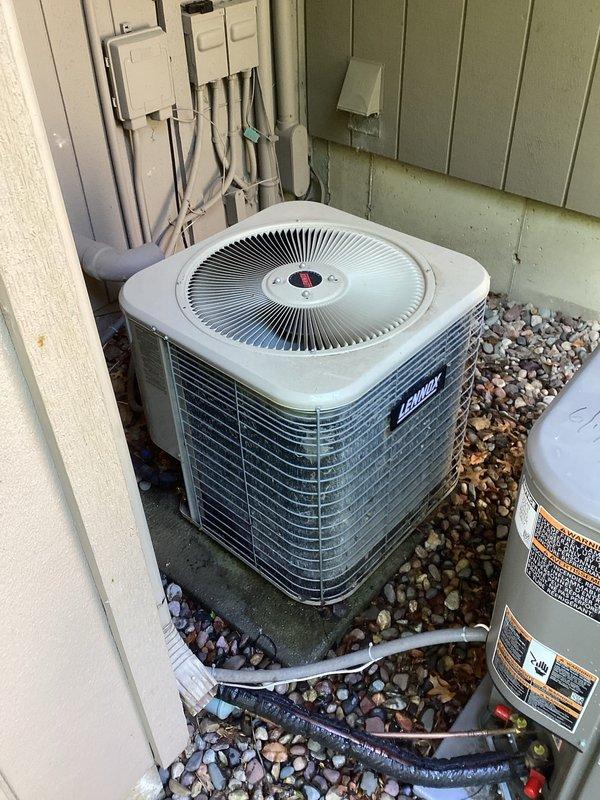 Responded to no cooling call for dual-system residential installation with two Lennox condenser units. Upon arrival, diagnosed both systems as low on refrigerant charge. Successfully recharged the older unit and restored cooling operation. Identified active refrigerant leak on newer system requiring follow-up repair visit to locate leak source, perform necessary repairs, and recharge system to manufacturer specifications.