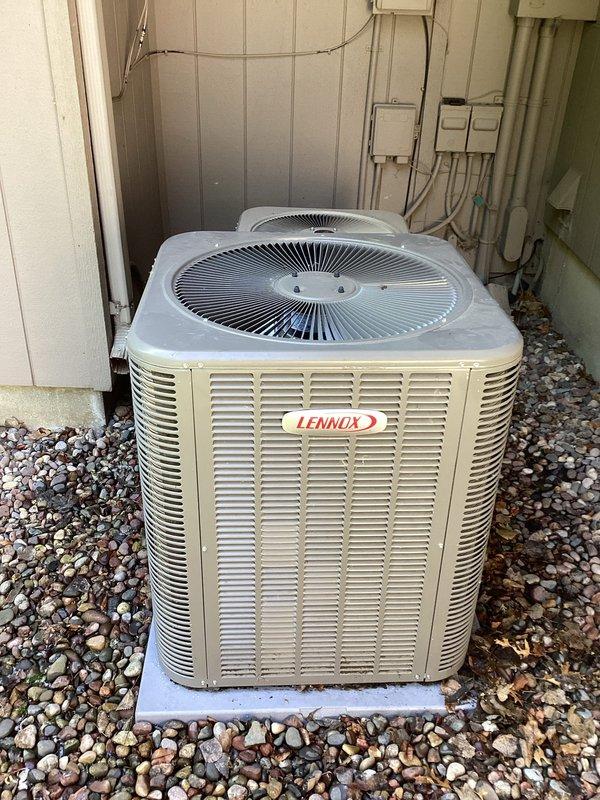 Responded to no cooling call for dual-system residential installation with two Lennox condenser units. Upon arrival, diagnosed both systems as low on refrigerant charge. Successfully recharged the older unit and restored cooling operation. Identified active refrigerant leak on newer system requiring follow-up repair visit to locate leak source, perform necessary repairs, and recharge system to manufacturer specifications.