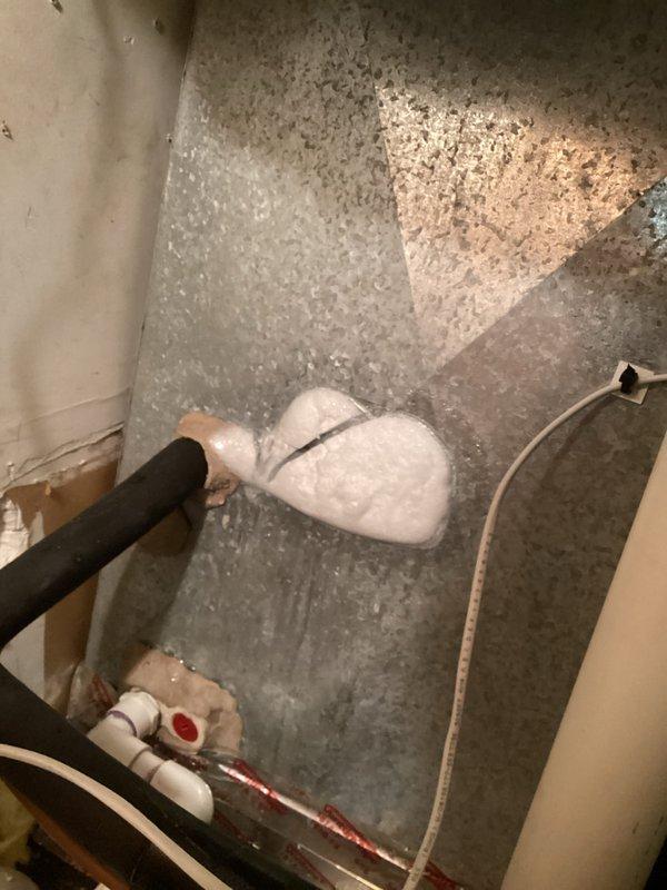Responded to no cooling call on residential HVAC system over 10 years old. Upon arrival, confirmed thermostat set to 70°F with indoor temperature reading 75°F. Performed diagnostic evaluation and determined system was low on refrigerant. Given the age of the equipment and the cost-effectiveness of repair versus replacement, recommended full system replacement. Customer approved replacement of aging unit. Inspected air filtration system and drainage components during service. Documented equipment condition with photographs showing existing air filters and condensate drain line configuration in mechanical space.