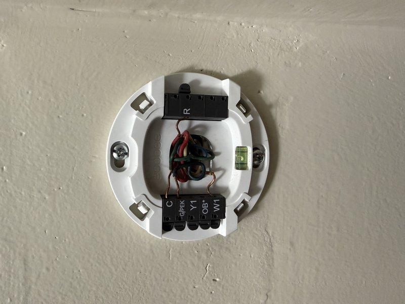 Responded to no cooling call. Upon arrival, found homeowner had recently installed Ecobee thermostat but was unsure of proper wiring connections. Inspection revealed two wires had been wire nutted together by homeowner during thermostat installation as they were uncertain of correct terminal placement. Identified proper wire connections, removed wire nuts, and correctly terminated all thermostat wiring to appropriate terminals on both the Ecobee and HVAC control board. Verified system operation and confirmed cooling function restored.