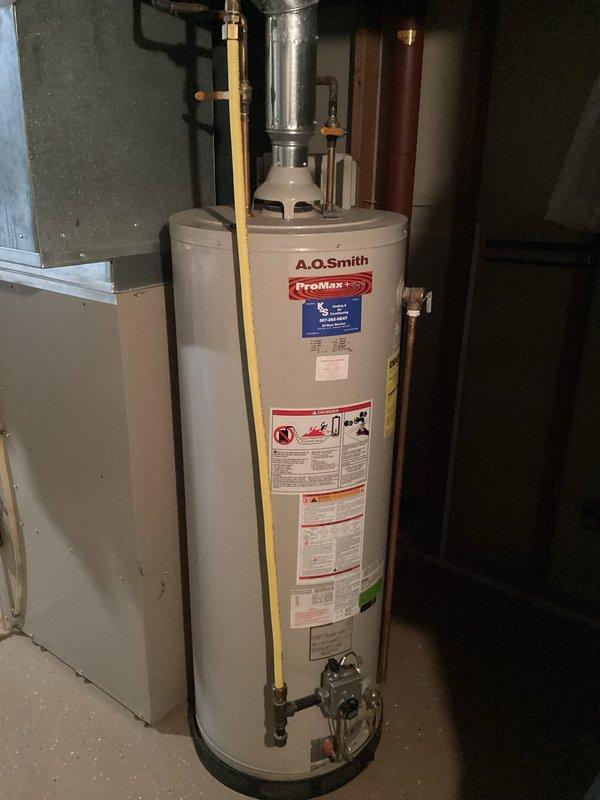 Responded to service call for non-functioning water heater and successfully completed full unit replacement. Removed existing failed water heater and installed new A.O. Smith ProMax tanked water heater in basement utility room. Connected all required plumbing lines including hot and cold water supply, installed temperature and pressure relief valve with proper discharge piping, and reconnected gas supply line with appropriate flexible connector. Verified all connections for proper operation and tested unit for safe functionality.