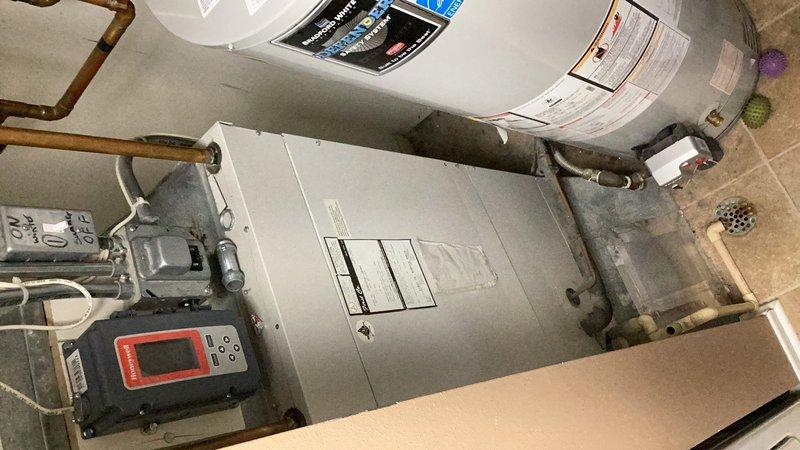Responded to no cooling complaint on residential HVAC system. Upon arrival, determined unit had no power and customer was unable to identify cooling mode on thermostat. Performed diagnostic assessment of equipment in mechanical room, including inspection of furnace/air handler and associated electrical components. Labeled thermostat with clear "HEAT" and "COOL" indicators to assist customer with system operation and mode identification. Documented equipment condition and configuration with diagnostic meter readings.