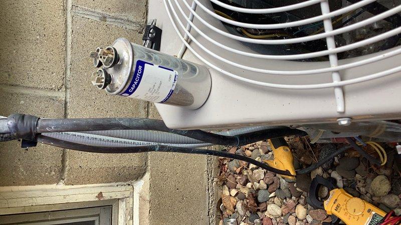 # HVAC Service Report - No Cooling Issue Resolved

## Summary
Responded to no cooling complaint on aging air conditioning system, diagnosed and replaced failed capacitor, verified refrigerant charge levels, and confirmed proper system operation before departure.

## Service Details

Upon arrival, performed initial assessment of outdoor condensing unit experiencing complete cooling failure. System showed no signs of operation when thermostat called for cooling. Conducted systematic diagnostic evaluation to identify root cause of malfunction.

Visual inspection revealed outdoor unit was non-responsive with no compressor or condenser fan activity. Utilized multimeter to test electrical components and quickly identified failed run capacitor as primary failure point. Capacitor showed no measurable capacitance and exhibited visible signs of deterioration consistent with age-related failure common in systems over ten years old.

Proceeded with capacitor replacement using appropriate OEM-equiv