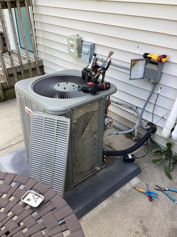 Responded to no cooling complaint on Bryant air conditioning system. Upon arrival, performed diagnostic assessment and identified two primary failures: significantly low refrigerant charge indicating a leak in the system, and a failed capacitor preventing compressor operation. Conducted visual inspection of the outdoor condensing unit which revealed poor overall condition consistent with inadequate maintenance history. Given the combination of multiple component failures, active refrigerant leak requiring leak detection and repair, and the deteriorated state of the equipment, recommended complete system replacement as the most cost-effective solution rather than pursuing repairs on a compromised unit.