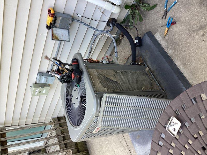 Responded to no cooling complaint on Bryant air conditioning system. Upon arrival, performed diagnostic assessment and identified two primary failures: significantly low refrigerant charge indicating a leak in the system, and a failed capacitor preventing compressor operation. Conducted visual inspection of the outdoor condensing unit which revealed poor overall condition consistent with inadequate maintenance history. Given the combination of multiple component failures, active refrigerant leak requiring leak detection and repair, and the deteriorated state of the equipment, recommended complete system replacement as the most cost-effective solution rather than pursuing repairs on a compromised unit.