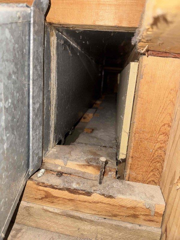 Responded to emergency call for water leak affecting bathroom wall and ceiling, initially reported after AC activation. Upon investigation, identified leak source as lavatory supply lines compromised during recent remodeling work. Replaced damaged section of 1/2" copper fittings and associated connections to eliminate leak. Documented repair work with photographs showing access point through floor opening and surrounding plumbing infrastructure.